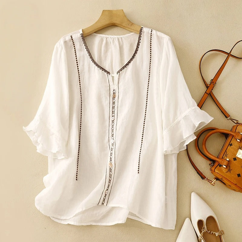 Blouse élégante à manches volantées, parfaite pour des occasions formelles. 0