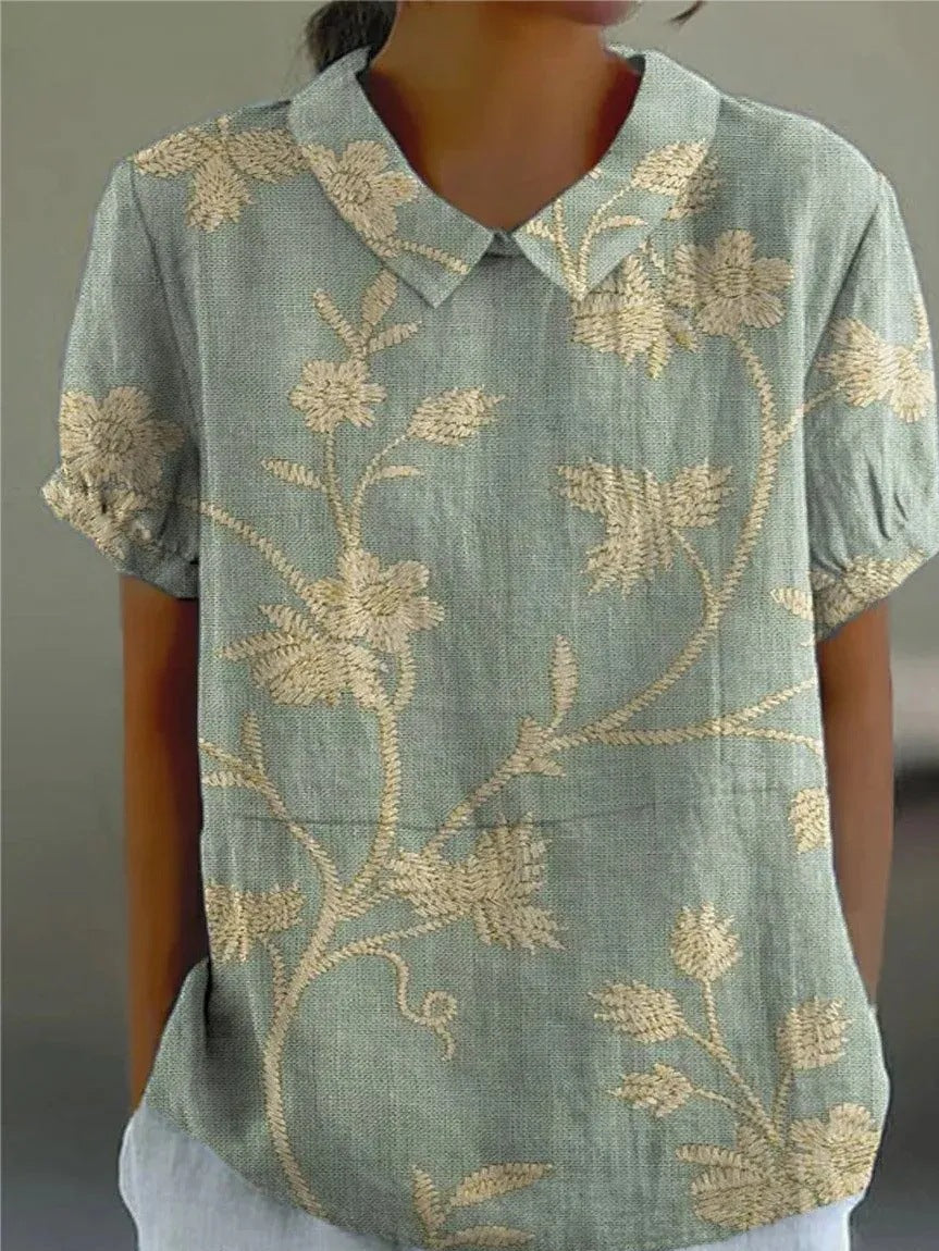 Chemise femme à design floral décontracté et coupe fluide. 0