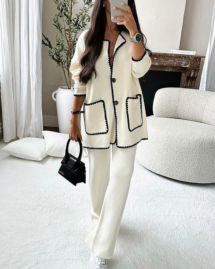 Ensemble tailleur femme chic, comprenant une veste longue élégante avec bordure contrastée et un pantalon assorti, idéal pour des occasions formelles - 1