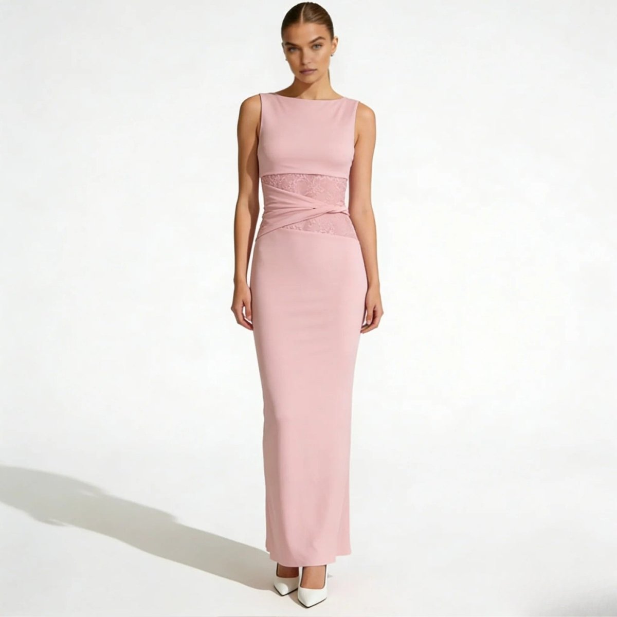 Elegant column dress with an asymmetrical wrap and refined lace detailing. 12