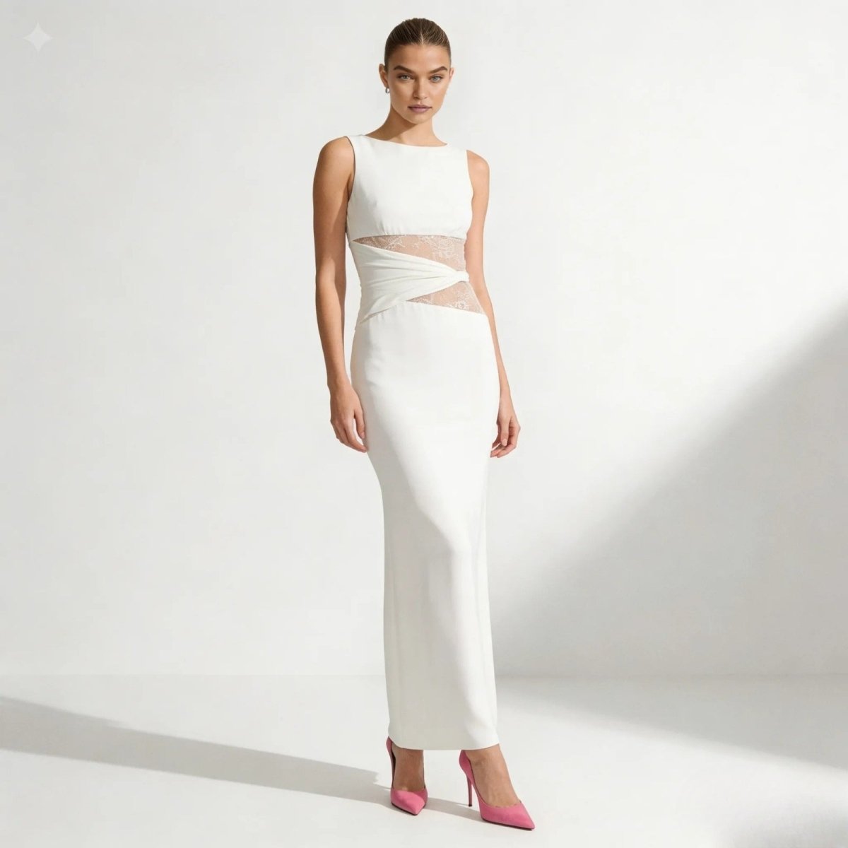 Elegant column dress with an asymmetrical wrap and refined lace detailing. 9