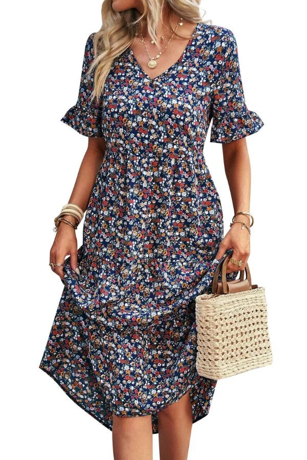 Robe d'été femme à imprimé floral, silhouette mi-longue et style chic. 2