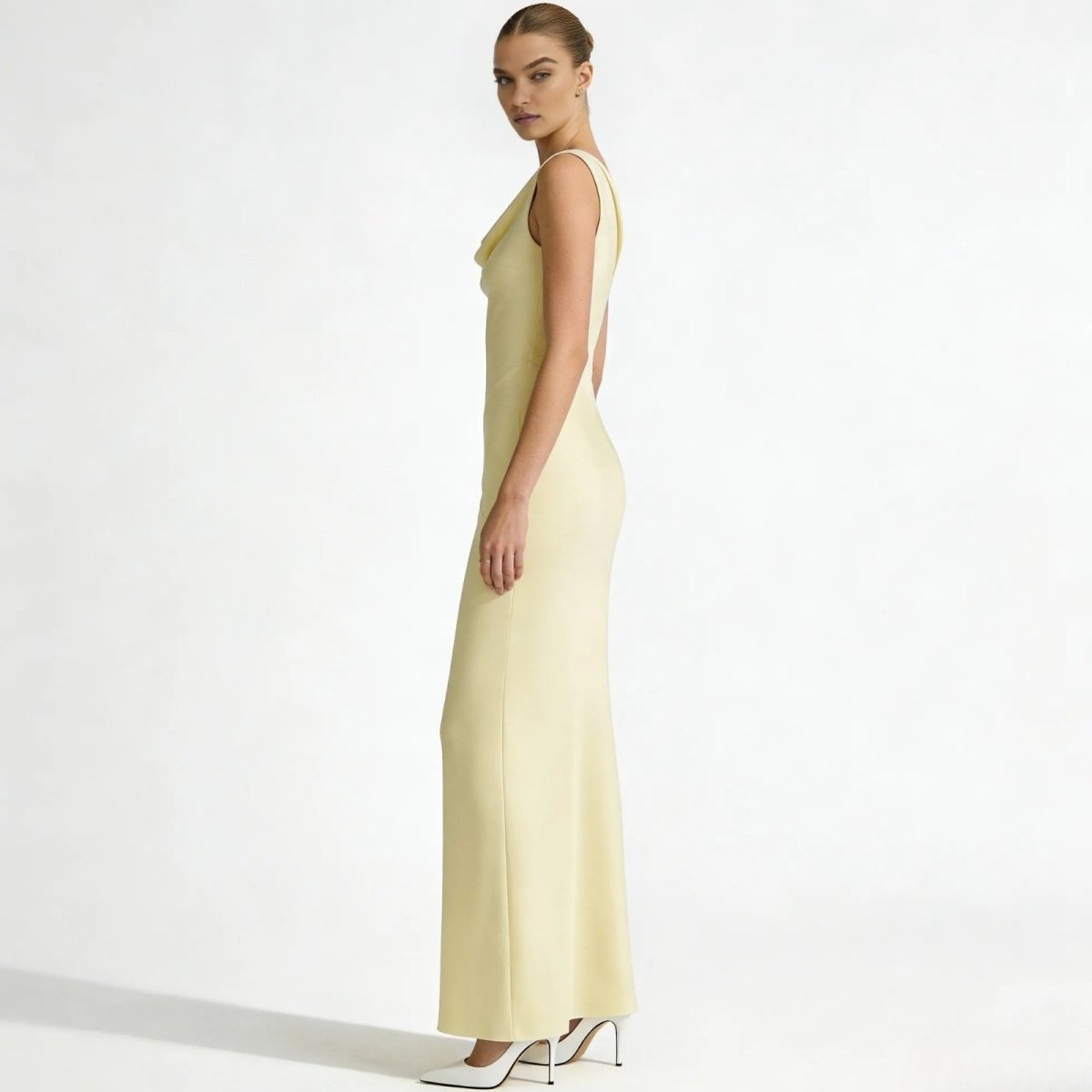Elegant backless dress with a sculpted silhouette for evening occasions. 1