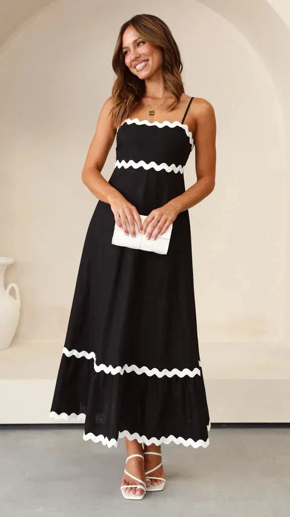 Robe longue élégante à bretelles réglables et silhouette fluide. 1