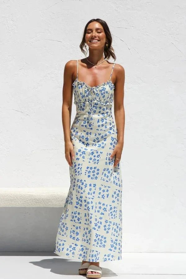 Robe midi élégante, silhouette droite avec volants et motifs floraux. 0
