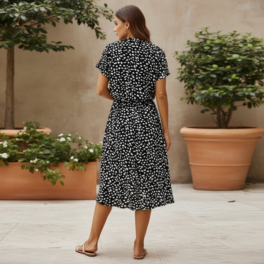 Robe midi élégante à design fluide et imprimé. - 10