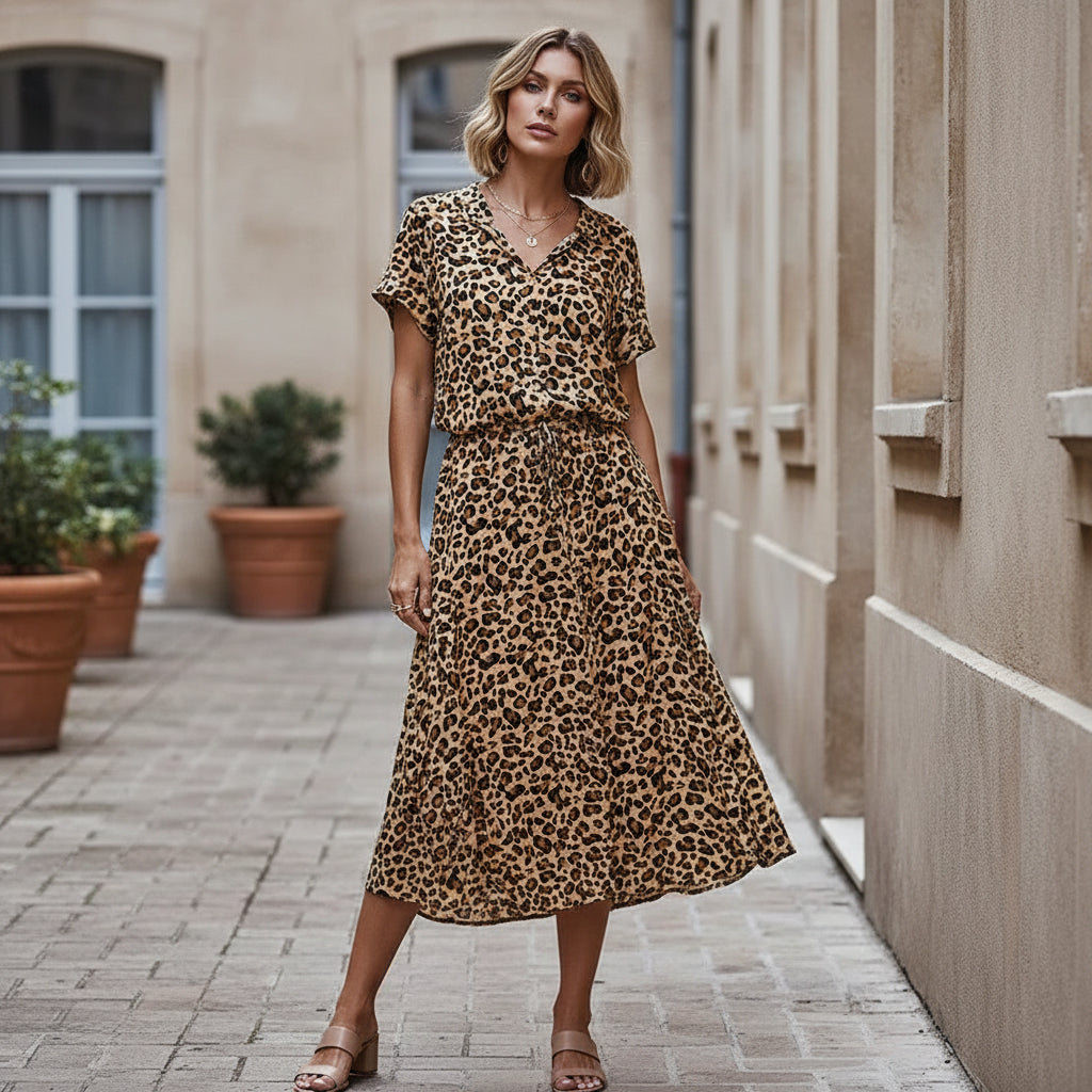Robe midi élégante à design fluide et imprimé. - 14