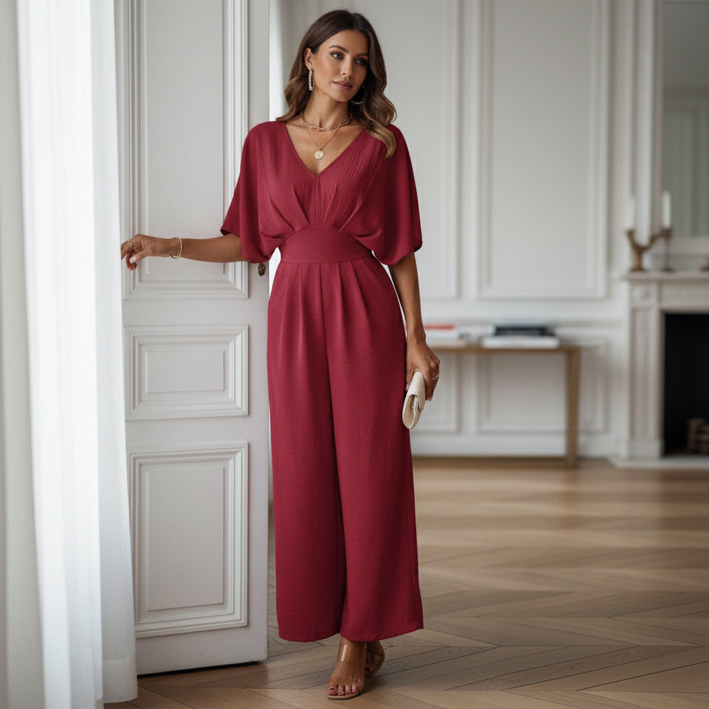 Combinaison femme à décolleté en V et pantalon évasé. - 1