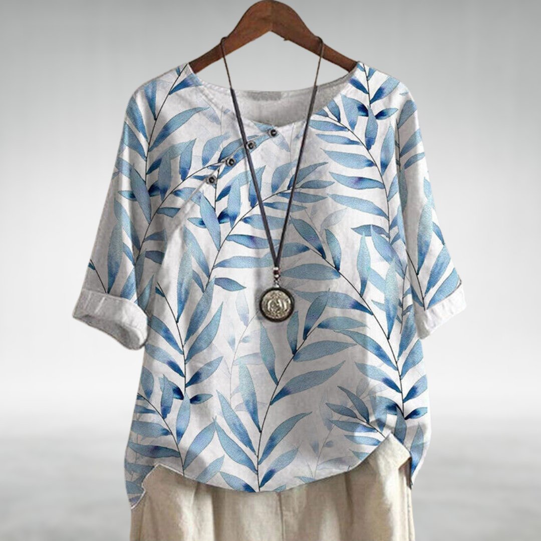 Blouse femme à coupe fluide avec détails uniques, idéale pour des occasions élégantes. 2
