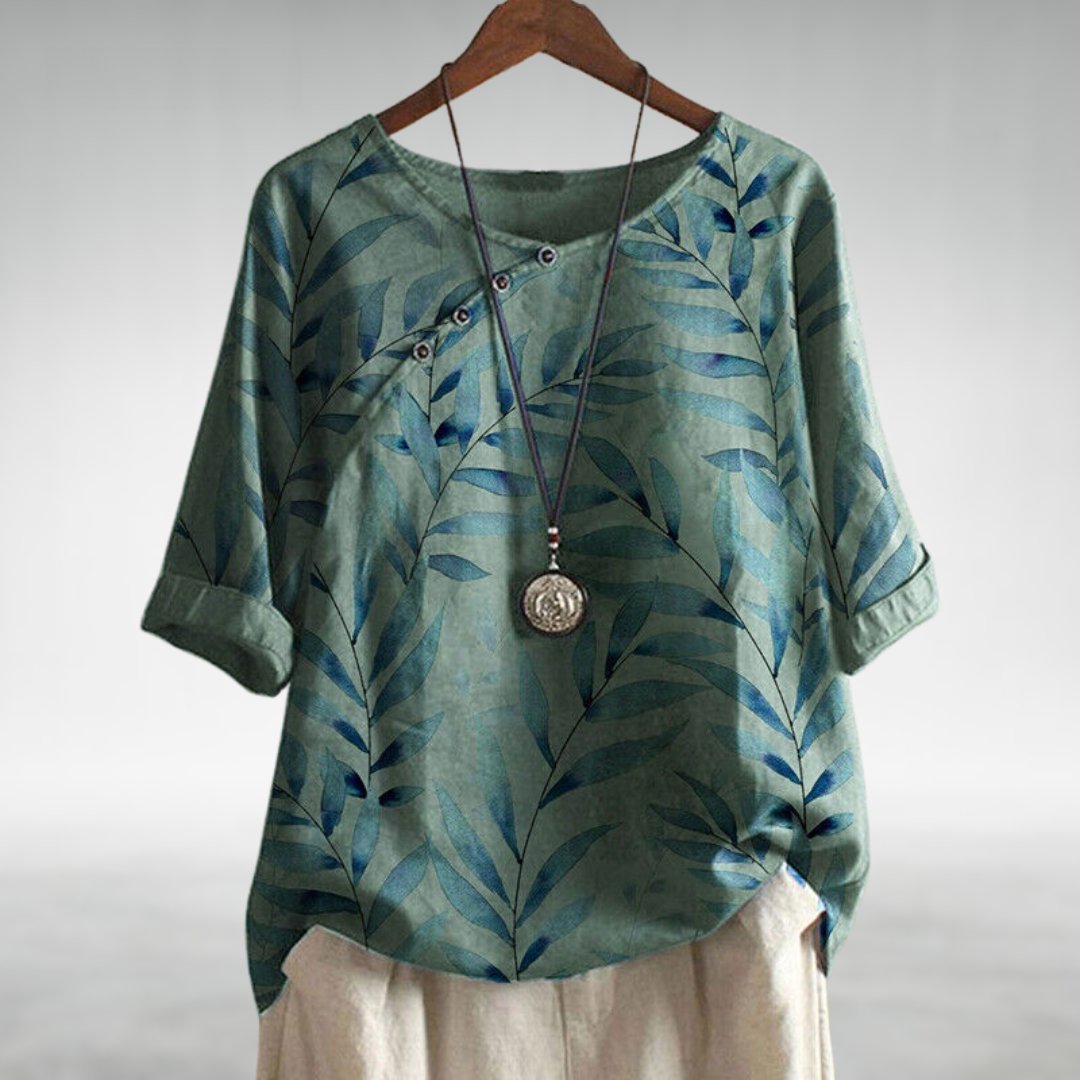 Blouse femme à coupe fluide avec détails uniques, idéale pour des occasions élégantes. 3