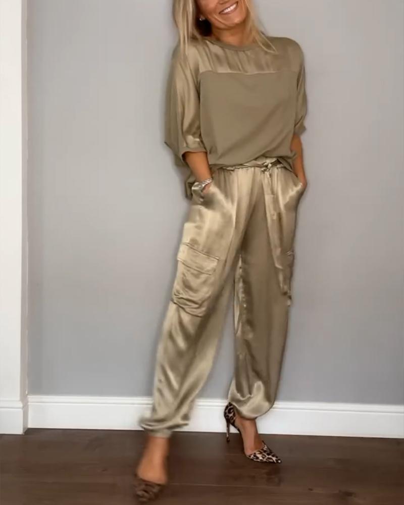 Ensemble tailleur femme comprenant un blazer ajusté et une robe chic cintrée. - 1