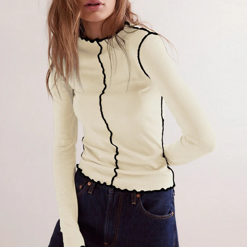 Haut à manches longues femme, design côtelé élégant, coupe ajustée. - 1