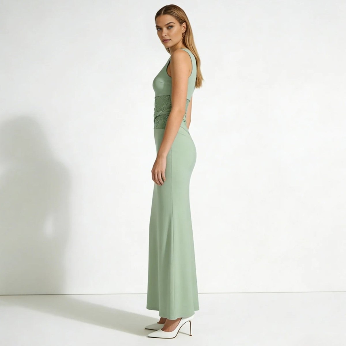 Elegant column dress with an asymmetrical wrap and refined lace detailing. 1