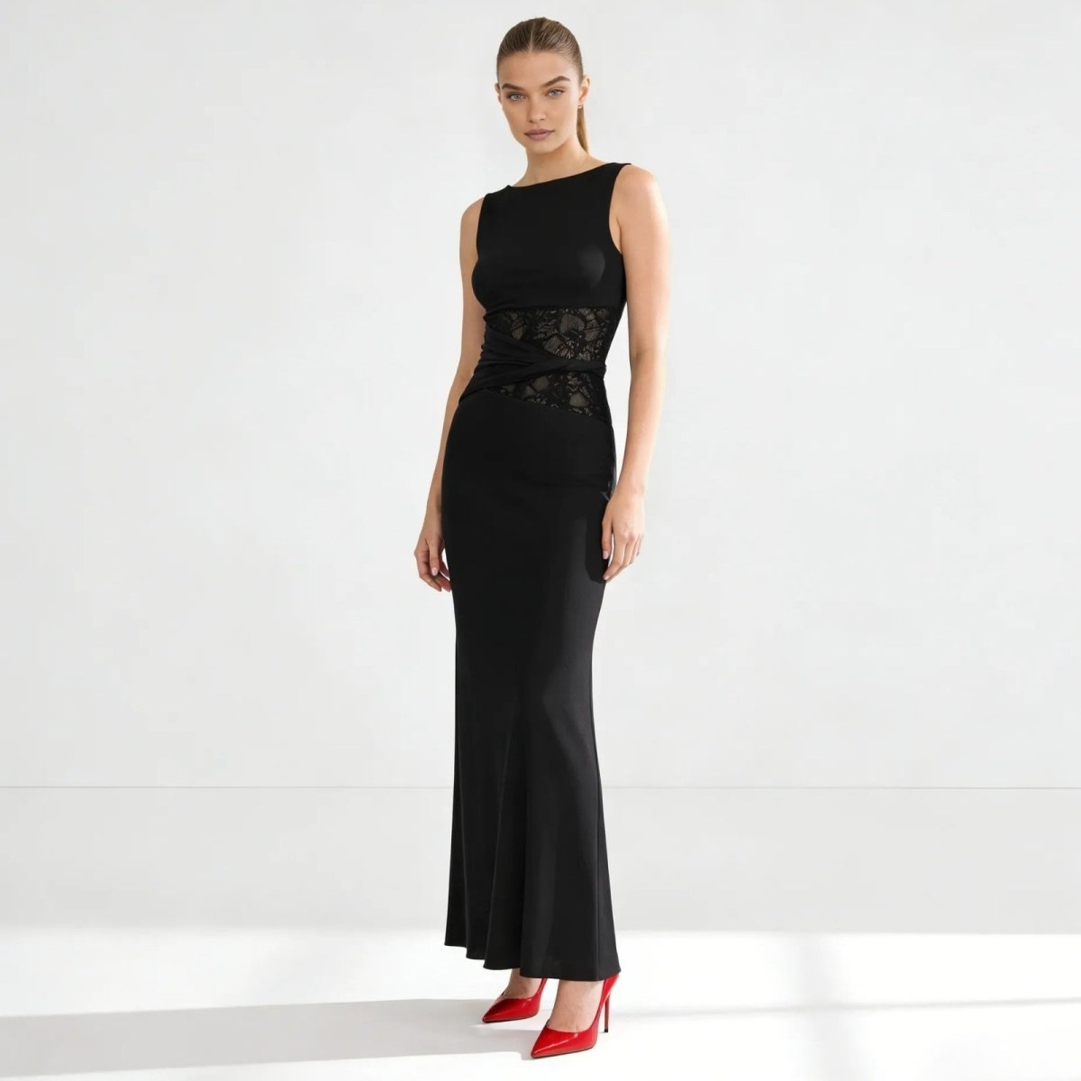 Elegant column dress with an asymmetrical wrap and refined lace detailing. 10