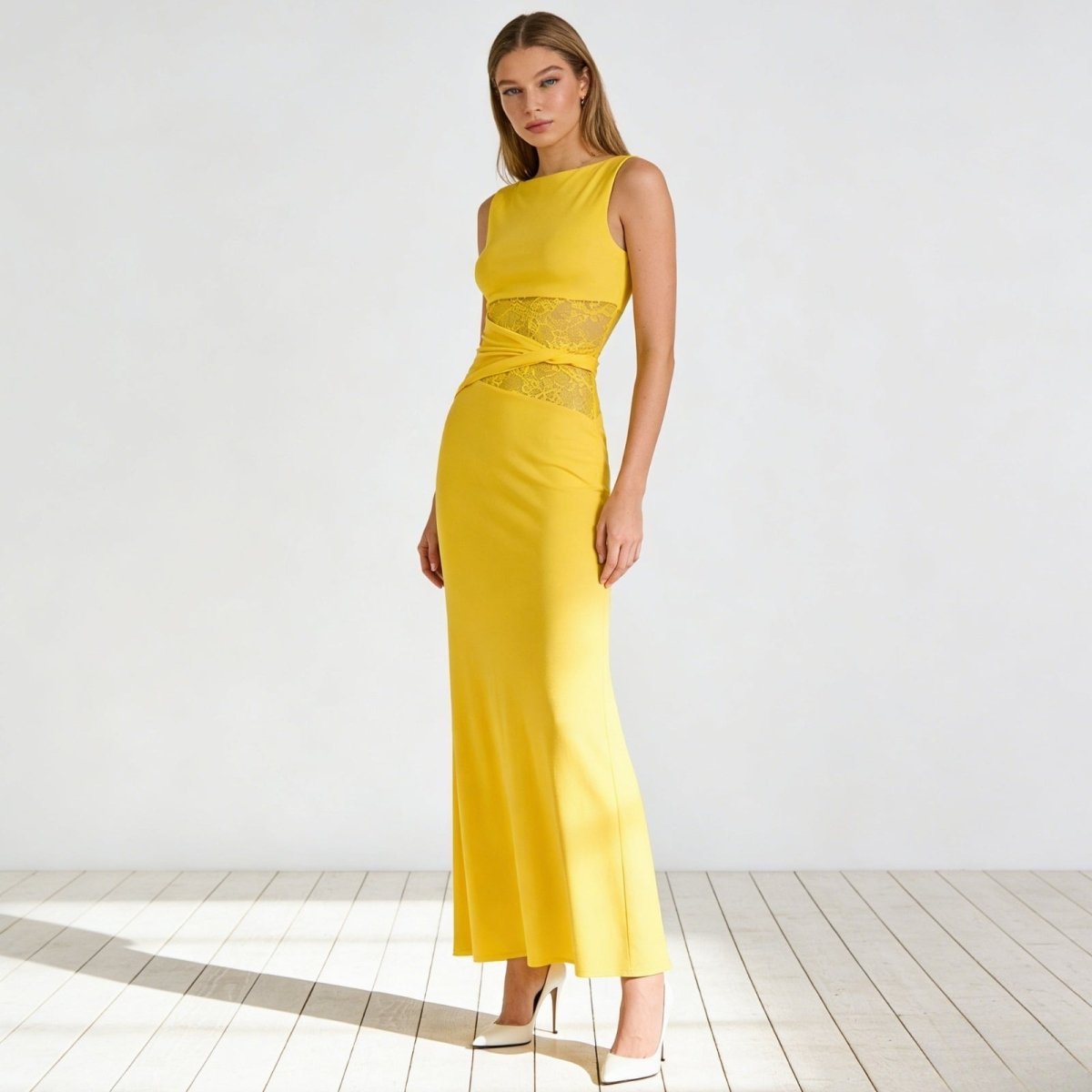 Elegant column dress with an asymmetrical wrap and refined lace detailing. 11