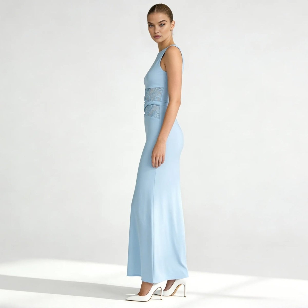 Elegant column dress with an asymmetrical wrap and refined lace detailing. 6