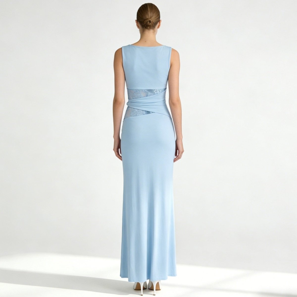 Elegant column dress with an asymmetrical wrap and refined lace detailing. 7
