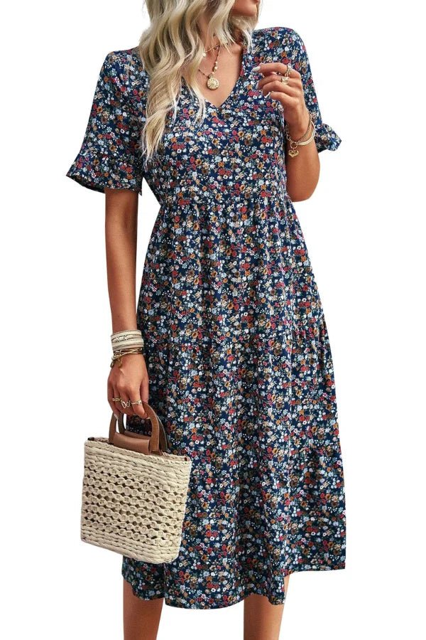 Robe d'été femme à imprimé floral, silhouette mi-longue et style chic. 4