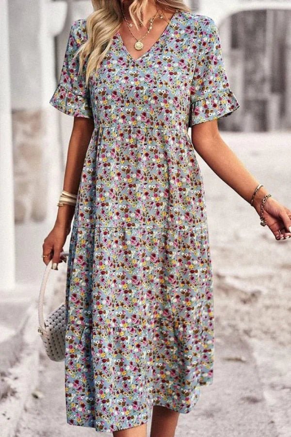 Robe d'été femme à imprimé floral, silhouette mi-longue et style chic. 9