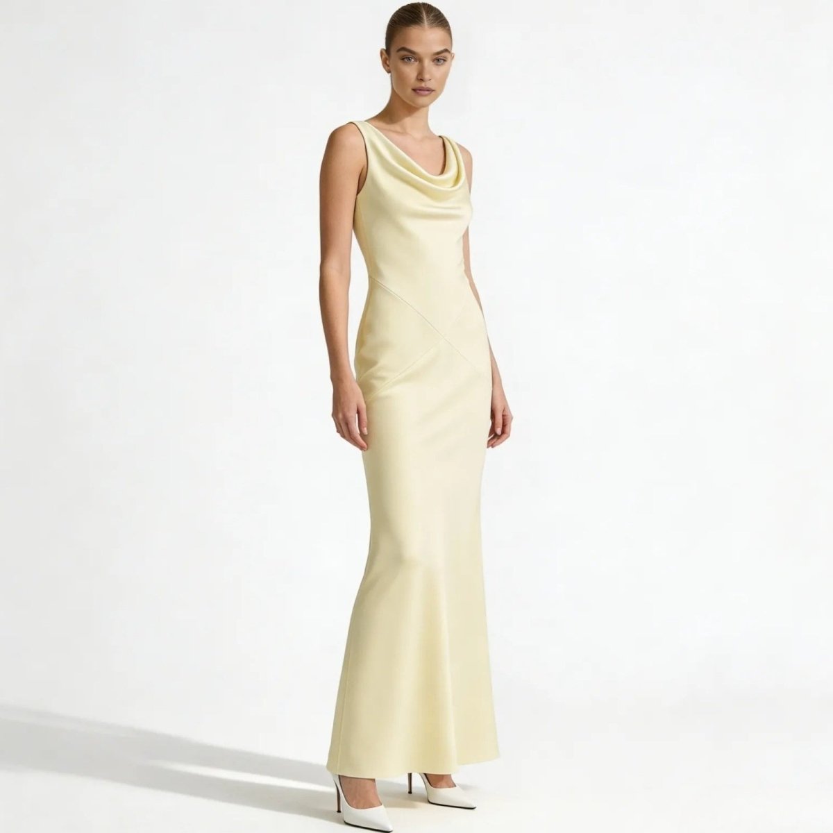 Elegant backless dress with a sculpted silhouette for evening occasions. 0