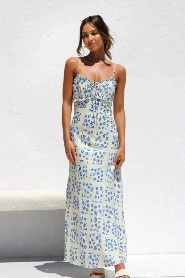 Robe midi élégante, silhouette droite avec volants et motifs floraux. 1