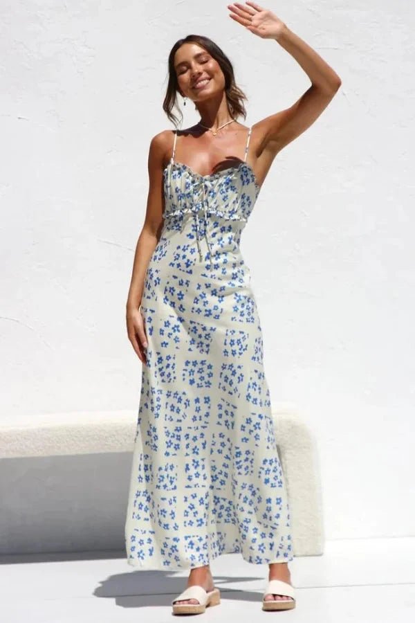 Robe midi élégante, silhouette droite avec volants et motifs floraux. 2