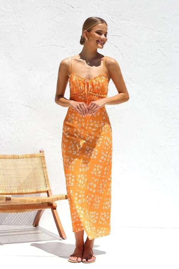 Robe midi élégante, silhouette droite avec volants et motifs floraux. 7