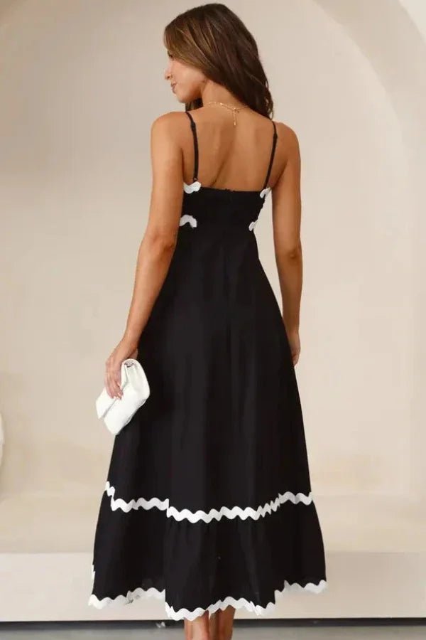 Robe midi évasée avec des détails festonnés élégants. - 2