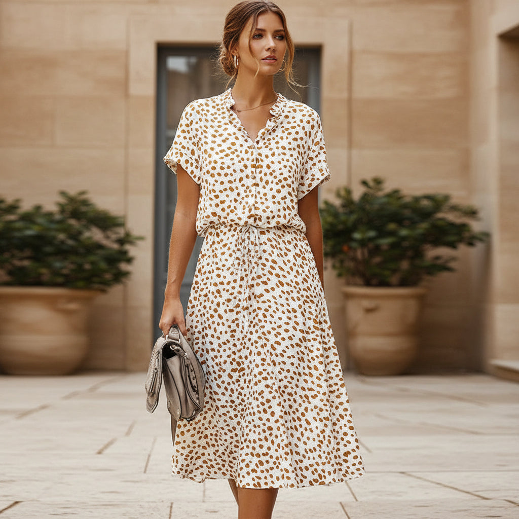 Robe midi élégante à design fluide et imprimé. - 1